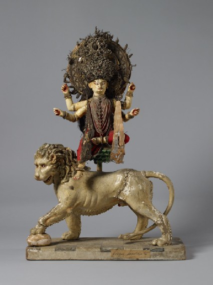 Figure of Durga Mahishasuramardini sitting on a lotus on the back of her lionfront