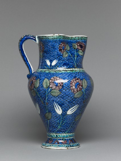 Jug with flowers against a fish-scale backgroundside