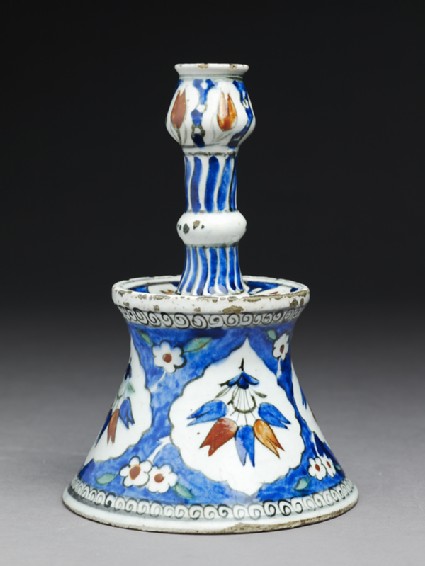 Candlestick with tulip blossomsside