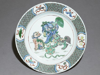 Dish with three lion dogs playing with a balltop