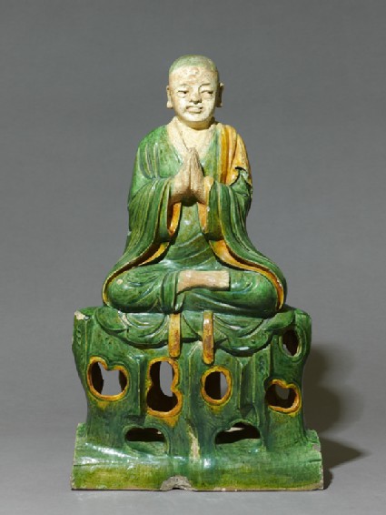 Roof ridge tile in the form of a seated Buddhist figurefront