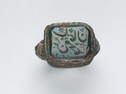 Octagonal seal ring with nasta‘liq inscription, branches, and a starfront