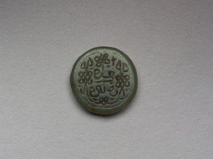 Circular bezel seal with naskhi inscription and plait decorationfront