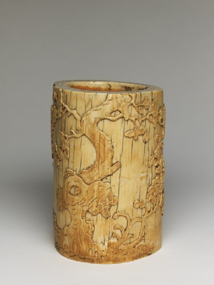 Ivory brush pot with plum blossoms and a poemoblique