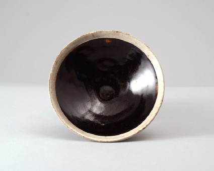 Black ware bowl with white rimfront