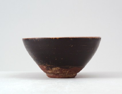 Black ware tea bowl with plum blossom decorationfront