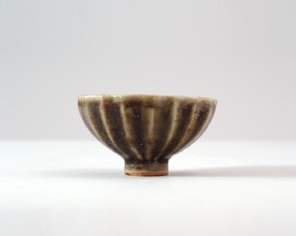 Greenware cup with fluted sidesfront