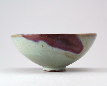 Bowl with blue glaze and purple splashesfront