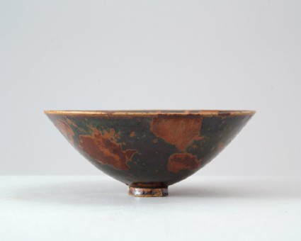 Black ware bowl with russet iron splashesfront