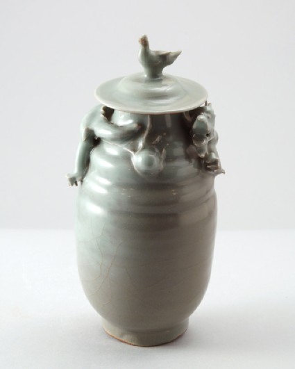 Greenware funerary jar with dragon and a birdfront