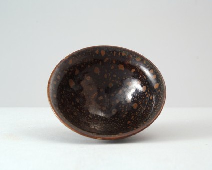 Black ware bowl with russet iron spotsfront