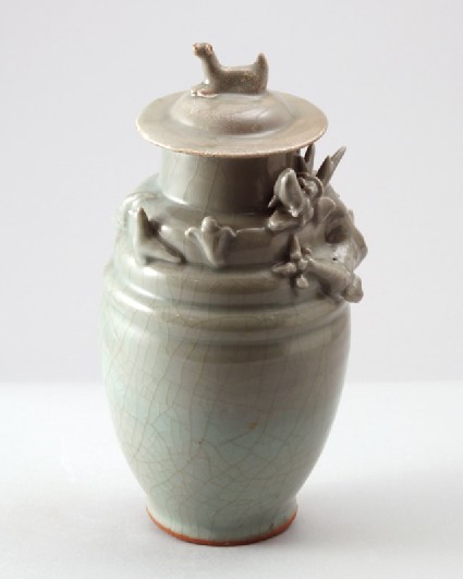 Greenware funerary jar and lid with dragon, bird, and a dogfront