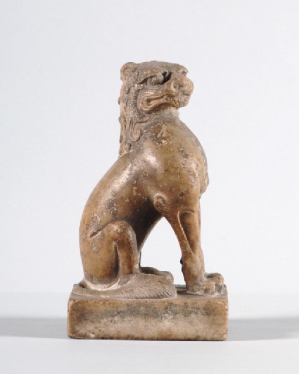 Figure of a seated lionfront