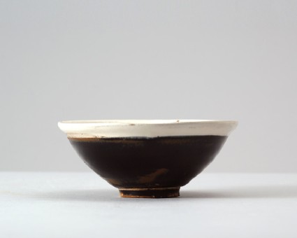 Black ware bowl with white rimfront