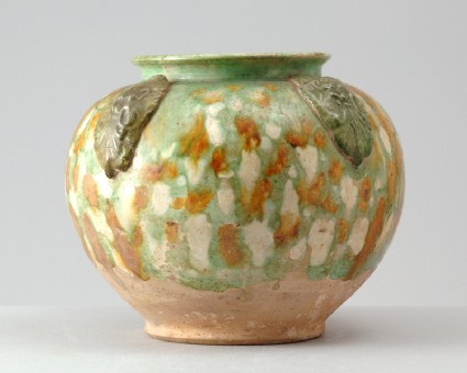 Jar with appliqué arabesque decoration under a three colour glazefront