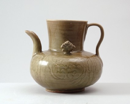 Greenware ewer with peony decoration amid wavesside