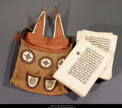 Unbound Qur'an with leather bagfront, MS. Arab.d.141, text block and leather bag