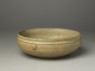 Greenware bowl with animal masks (oblique)