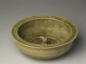 Greenware basin with small kneeling figure (oblique)