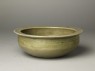 Greenware basin with small kneeling figure (oblique)