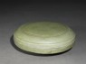 Greenware circular box and lid with floral decoration (oblique)