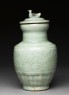 Greenware funerary vase with flowers and a bird (side)