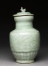 Greenware funerary vase with flowers and a bird (side)