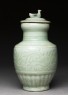 Greenware funerary vase with flowers and a bird (side)