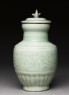 Greenware funerary vase with flowers and a bird (side)