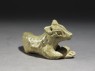 Greenware burial figure of a dog (oblique)