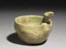 Greenware ladle with handle in the form of a bird-head (oblique)