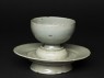 Greenware cup and stand with floral pattern (oblique)