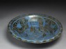 Dish with seated figure (oblique)