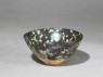 Black ware tea bowl with 'tortoiseshell' glazes (oblique)
