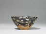 Black ware tea bowl with 'tortoiseshell' glazes (side)