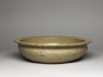 Greenware basin with fish, phoenix, and riding figures (oblique)