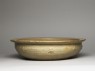 Greenware basin with fish, phoenix, and riding figures (oblique)