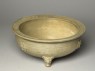 Greenware tripod bowl with hoof-shaped feet (oblique)