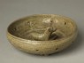 Greenware burial figure of dog in a pen (oblique)