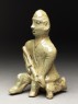 Greenware burial figure of man holding a staff (side)