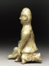 Greenware burial figure of man holding a staff (side)