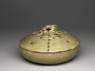 Greenware bowl and lid surmounted by an animal (oblique)