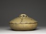 Greenware bowl and lid surmounted by an animal (side)