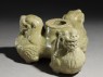 Greenware stand in the form of three lions (oblique)