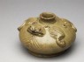 Greenware water pot in the form of a frog (oblique)