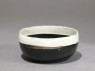 Black ware bowl with white rim (oblique)