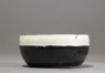 Black ware bowl with white rim (side)
