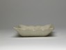 White ware dish with lotus flowers (side)