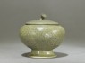 Globular greenware jar with lotus flower decoration (side)