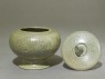 Globular greenware jar with lotus flower decoration (oblique, open)